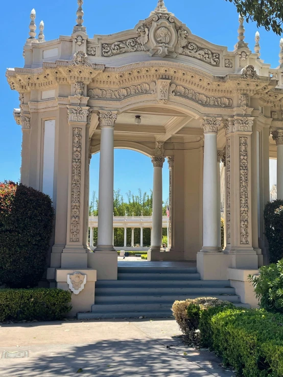 a gazebo sitting in the middle of a lush green park, a marble sculpture, art nouveau, profile image, bay area, many doorways, gigantic pillars and flowers
