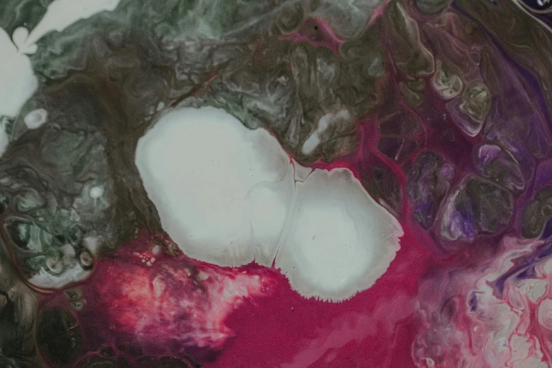 a close up of a cell phone on a table, an ultrafine detailed painting, inspired by Shōzō Shimamoto, unsplash, fuschia skin, milk bath photography, fractal fungus, abstract white fluid