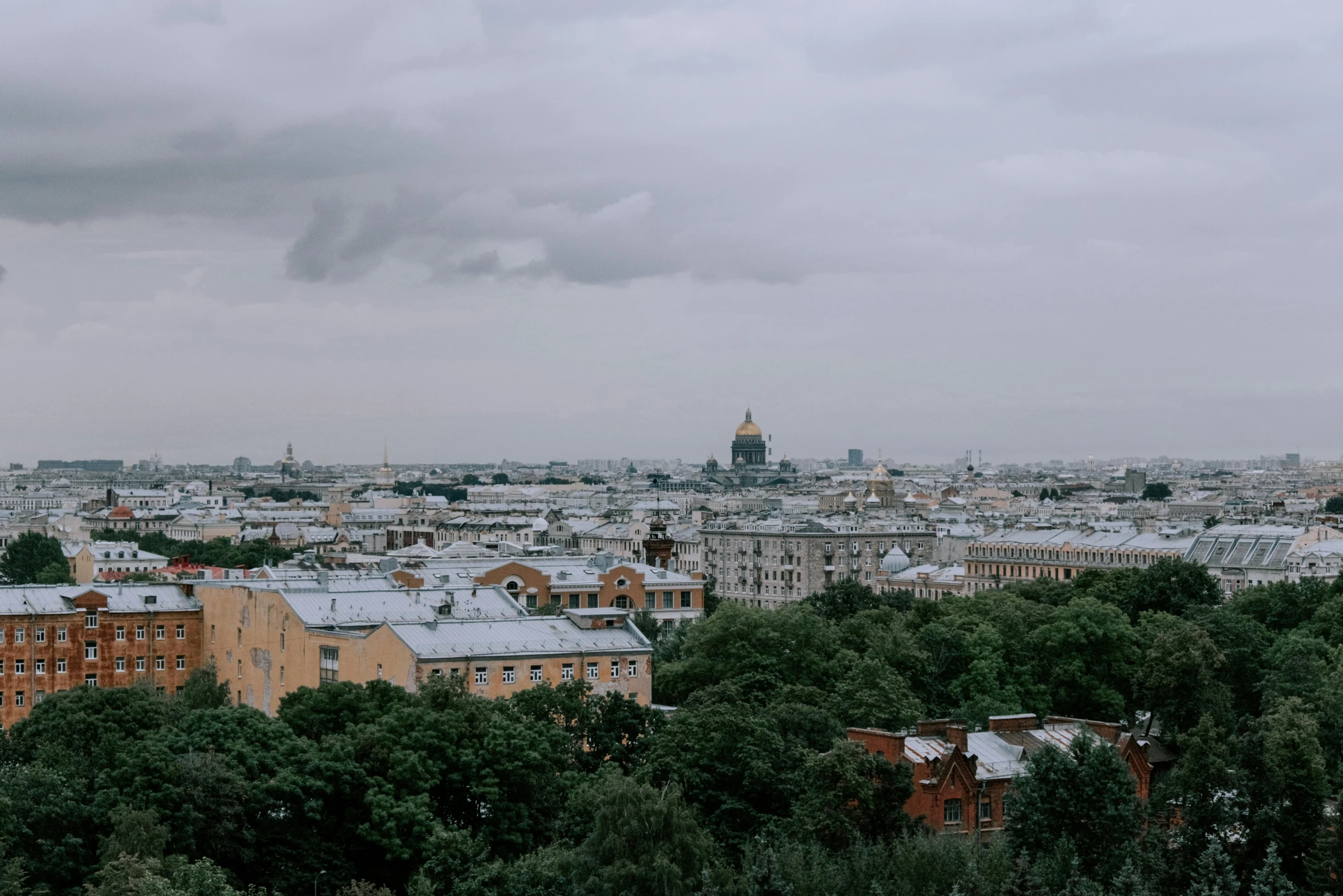 a view of a city from the top of a hill, by Emma Andijewska, pexels contest winner, socialist realism, overcast gray skies, saint petersburg, 2 0 0 0's photo, background image