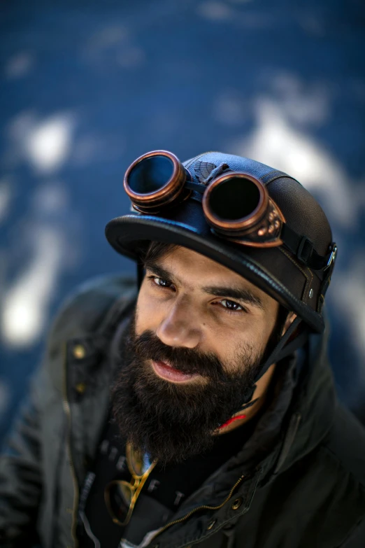 a man with a beard wearing a helmet and goggles, featured on reddit, editorial portrait, binoculars, face looking skyward, thumbnail