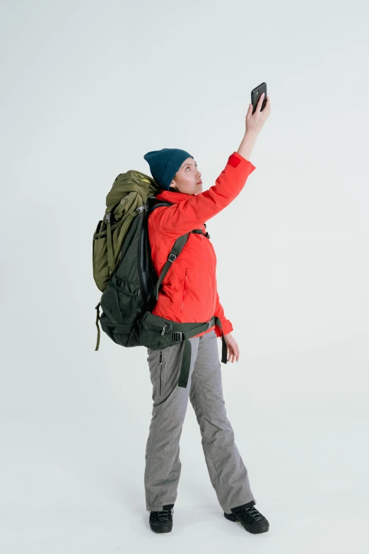 a man taking a picture with his cell phone, by Haukur Halldórsson, a man wearing a backpack, on clear background, an epic non - binary model, touring