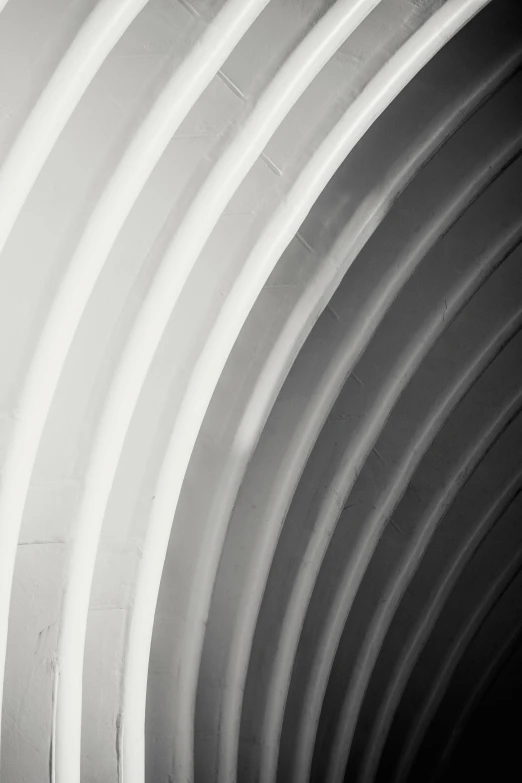 a black and white photo of a man riding a skateboard, inspired by Edward Weston, unsplash, light and space, detail structure, rounded roof, colours, abstract detail