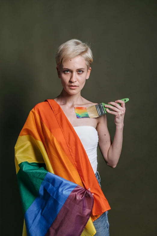 a woman in a white tank top holding a rainbow flag, an album cover, featured on reddit, holding flask in hand, joel fletcher, official photo, nadezhda tikhomirova