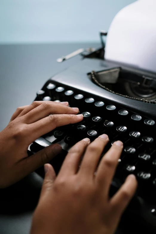 a person typing on an old fashioned typewriter, by Carey Morris, splash image, multiple stories, abcdefghijklmnopqrstuvwxyz, breeding
