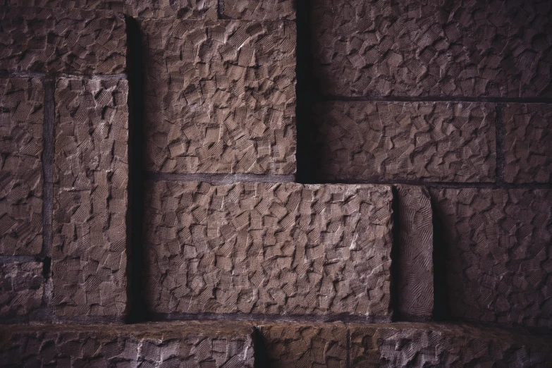 a group of stone blocks stacked on top of each other, an album cover, unsplash, brutalism, highly detailed textured 8k, brown, ignant, close up 1 9 9 0