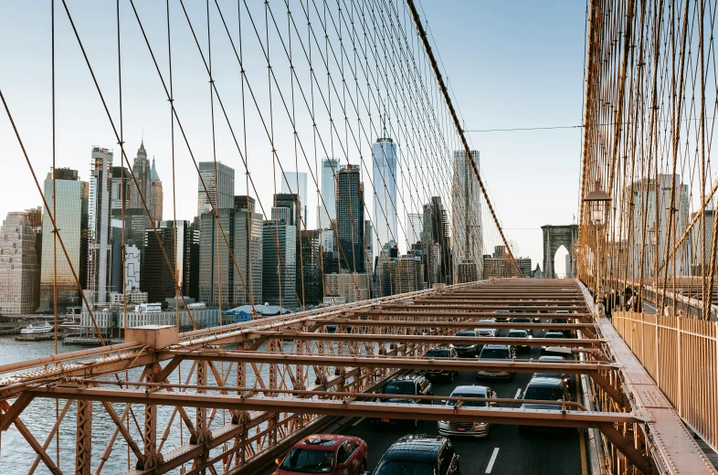 a view of a city from the top of a bridge, inspired by Thomas Struth, pexels contest winner, cars parked underneath, brooklyn, nets, high resolution image