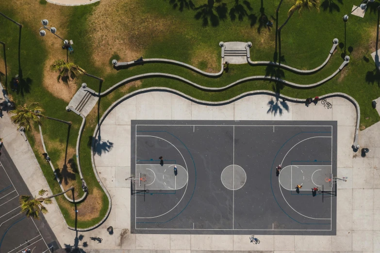 an aerial view of a basketball court surrounded by palm trees, unsplash contest winner, realism, parks and public space, public art, some of the blacktop is showing, video game assets