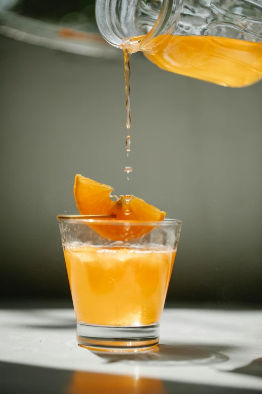 a person pouring orange juice into a glass, inspired by François Bocion, on a gray background, old fashioned, thumbnail, uncrop