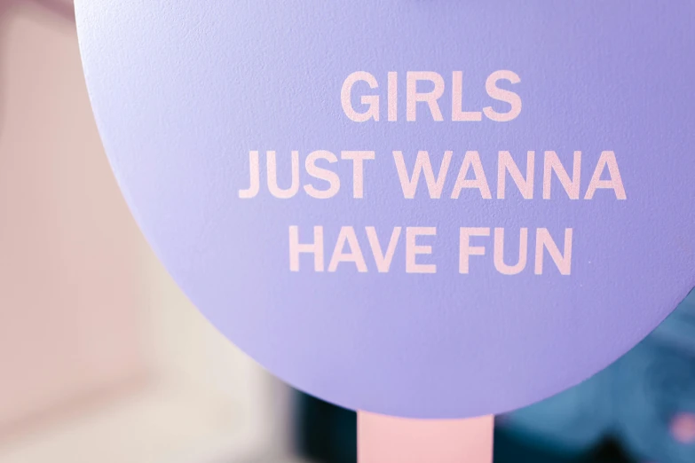 a sign that says girls just wanna have fun, unsplash, blue and purple colour scheme, lollipops, woamn is curved, detail shot