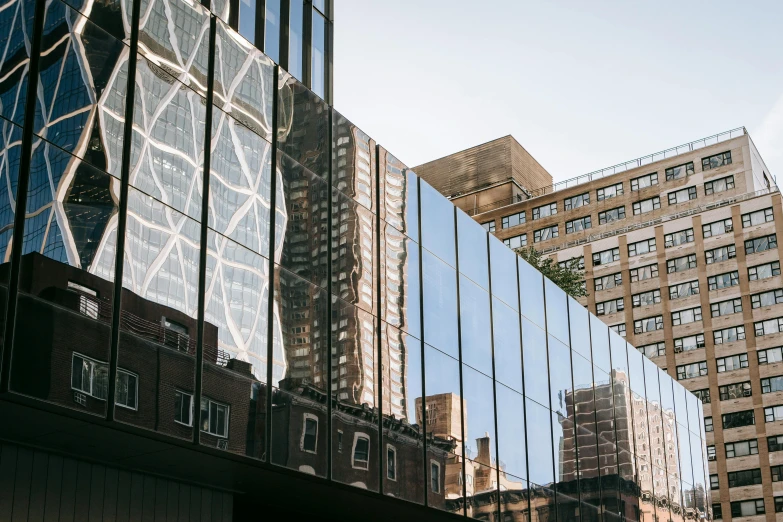 a couple of buildings that are next to each other, a photo, inspired by Vivian Maier, unsplash contest winner, modernism, glossy shiny reflective, ignant, sydney hanson, architecture and more