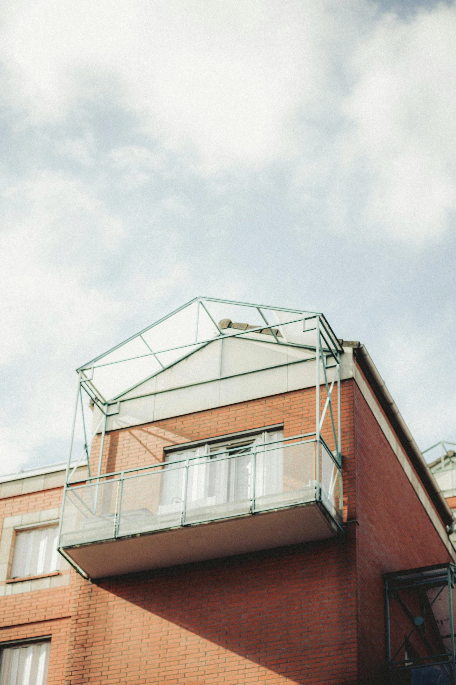 a man flying through the air while riding a skateboard, unsplash, modernism, gambrel roof building, plants on balconies, glass cover, full frame image