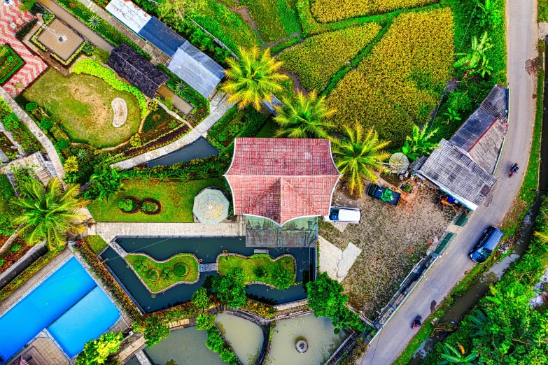 a bird's eye view of a house surrounded by rice fields, pexels contest winner, exterior botanical garden, thumbnail, having fun, lagoon