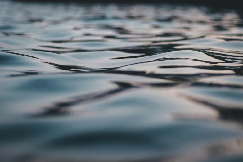 a close up of a body of water, a picture, unsplash, subtle depth of field, flattened, trending photo, water levels