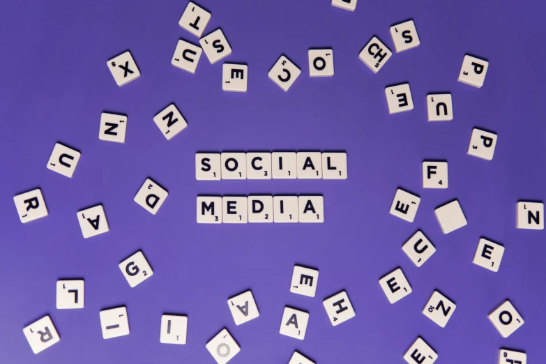 scrabbles spelling social media on a purple background, a photo, trending on pexels, profile image