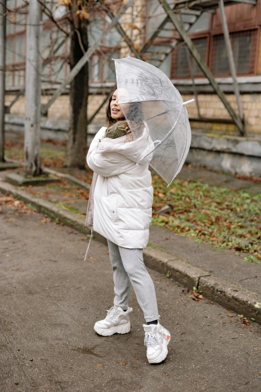 a woman standing on the side of a road holding an umbrella, transparent puffer jacket, wearing white tights, 8k)), in russia