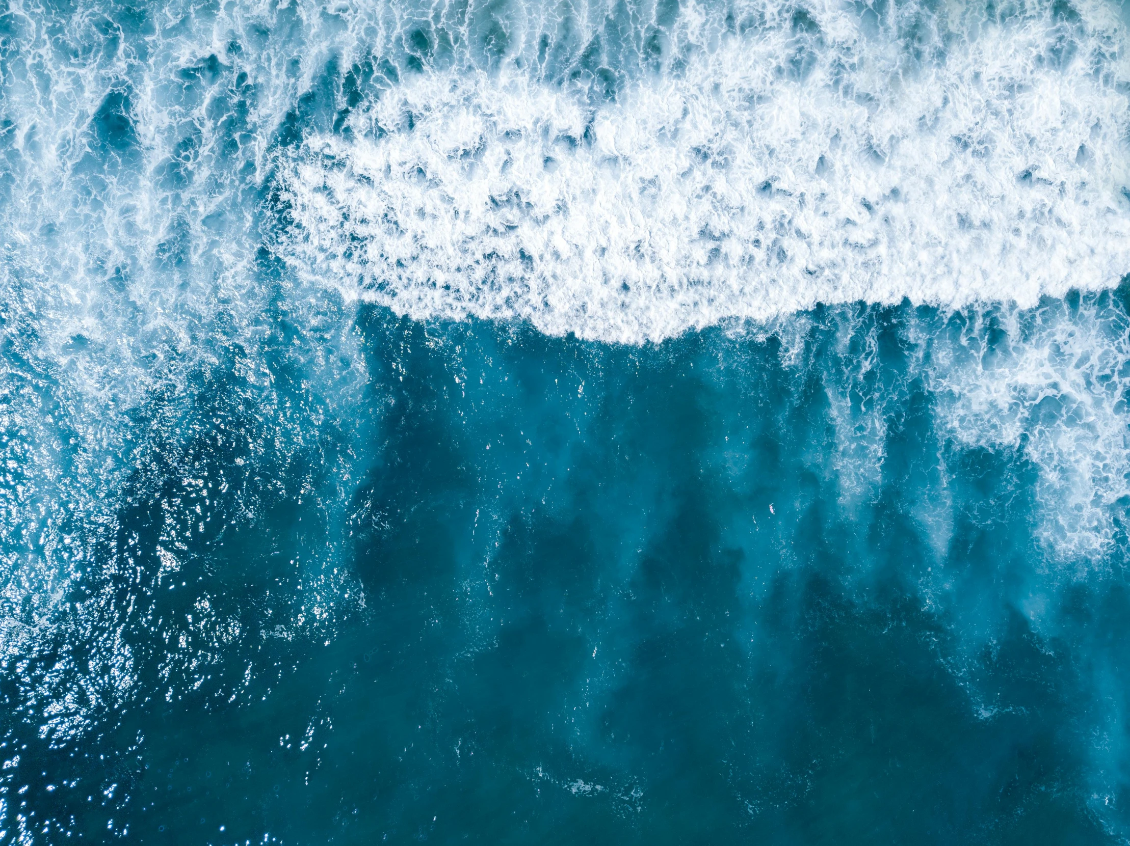 a person riding a surfboard on top of a wave, pexels contest winner, minimalism, helicopter view, thumbnail, blue crashing waves, sea foam