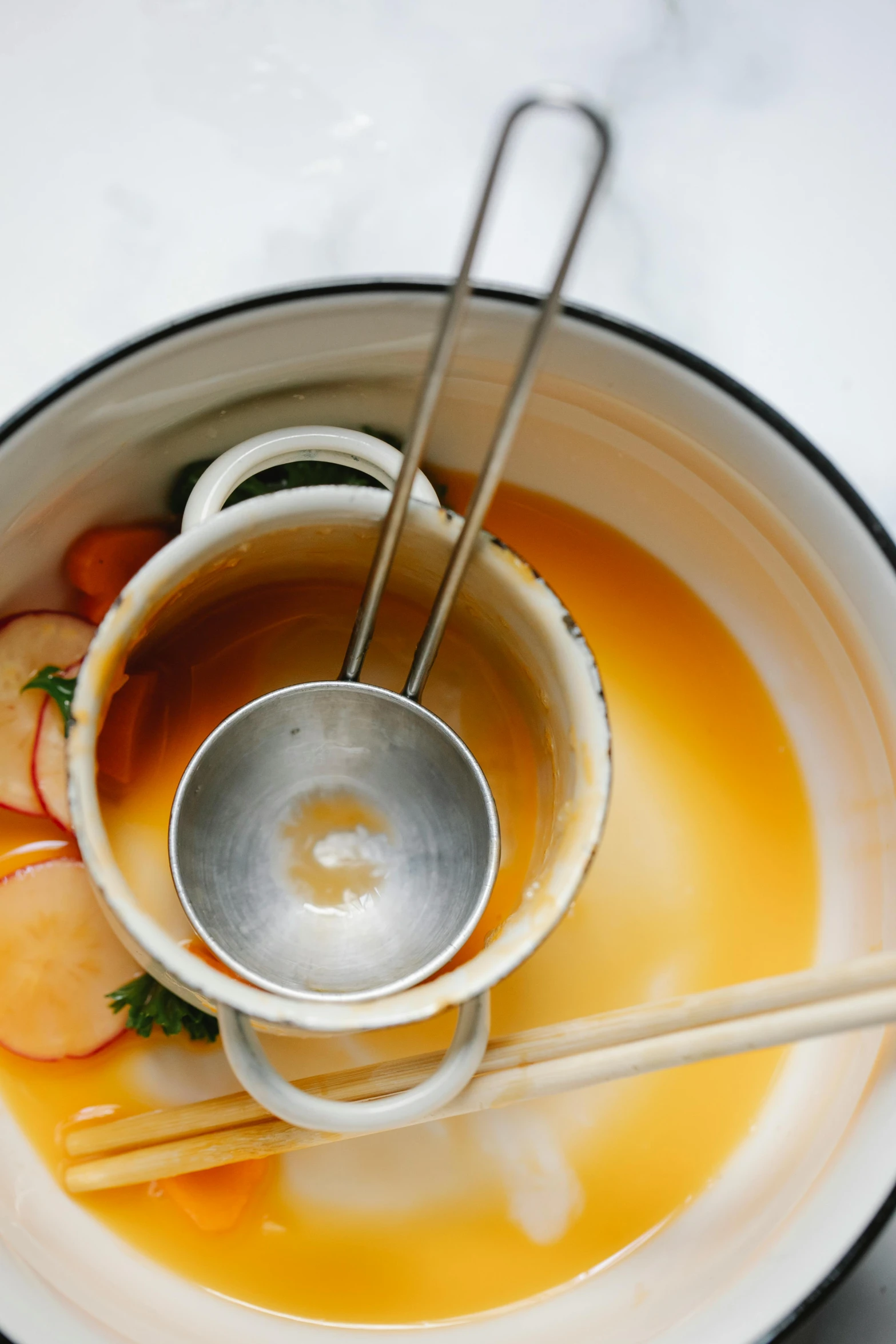 a bowl of soup with chopsticks in it, unsplash, process art, square, booze, mango, made of glazed