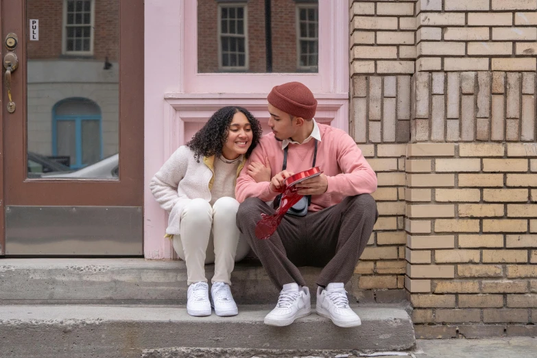 a man and woman sitting on the steps of a building, pexels contest winner, happening, cute scene, promotional image, hispanic, february)