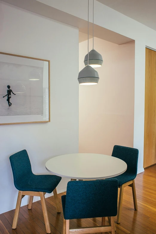 a dining room with a white table and blue chairs, poster art, unsplash, light and space, light lighting side view, corner, from street level, 3 - piece