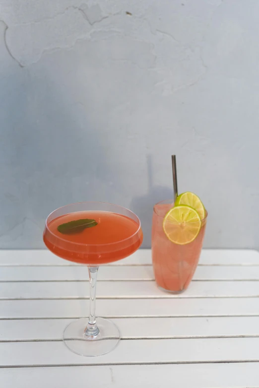 a couple of drinks sitting on top of a white table, profile image, hibiscus, daily specials, lemon