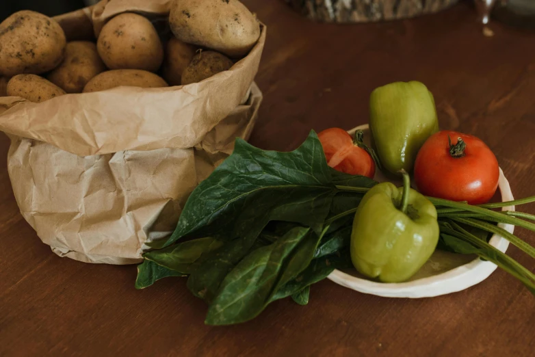 a bunch of vegetables sitting on top of a wooden table, profile image