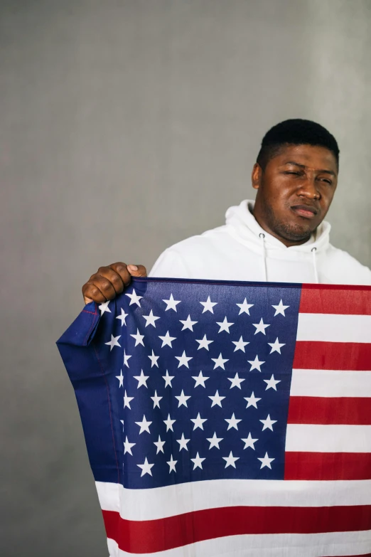 a man holding an american flag in his hands, an album cover, trending on unsplash, renaissance, handsome hip hop young black man, yung lean, disappointed, state of the union