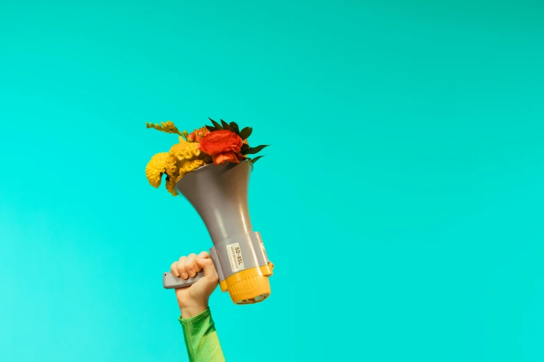 a person holding a vase with flowers in it, an album cover, by Dan Content, pexels contest winner, cyan and orange, the torch we all must hold, loud colors, product design shot