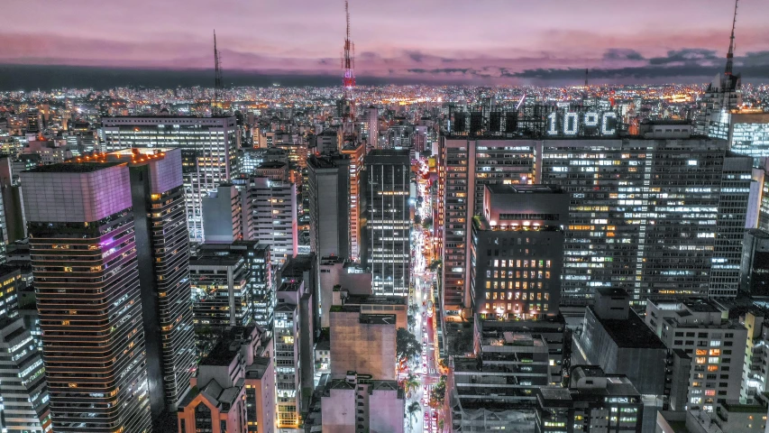 an aerial view of a city at night, pexels contest winner, são paulo, japan sightseeing, coloured photo, youtube thumbnail