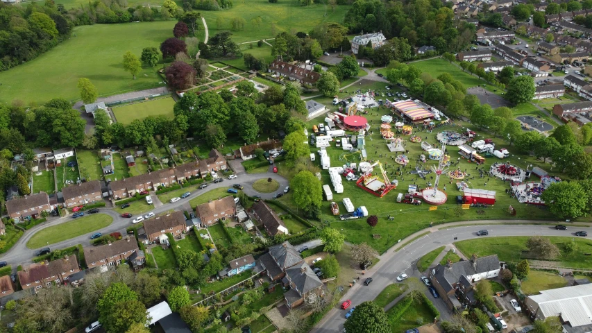 an aerial view of an amusement park, by Julian Allen, happening, madgwick, community celebration, some stalls, grey