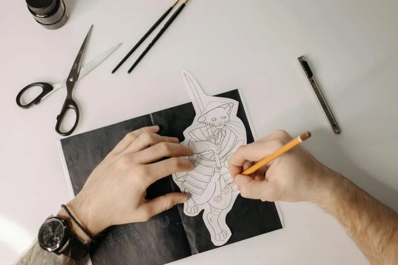 a person drawing a picture on a piece of paper, a drawing, by Mór Than, trending on pexels, paper cutout, fantasy artist, costume design made with love, lineart behance hd