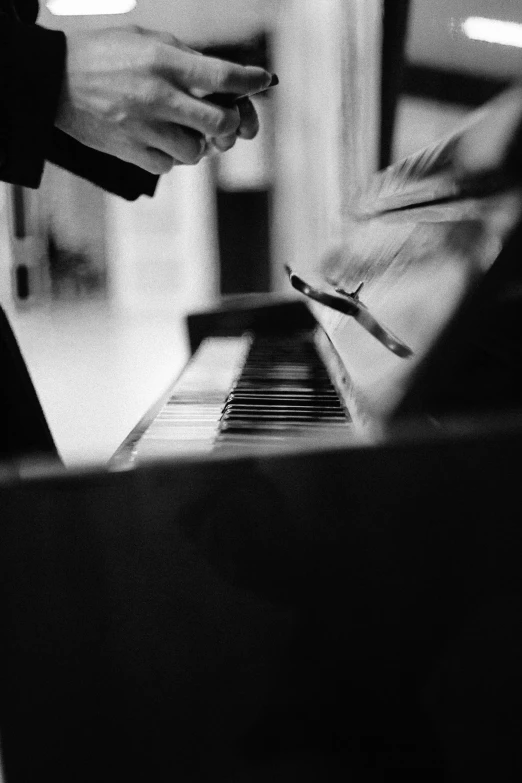 a close up of a person playing a piano, a black and white photo, by Alexis Grimou, ✨🕌🌙, :: morning, uploaded, heaven on earth