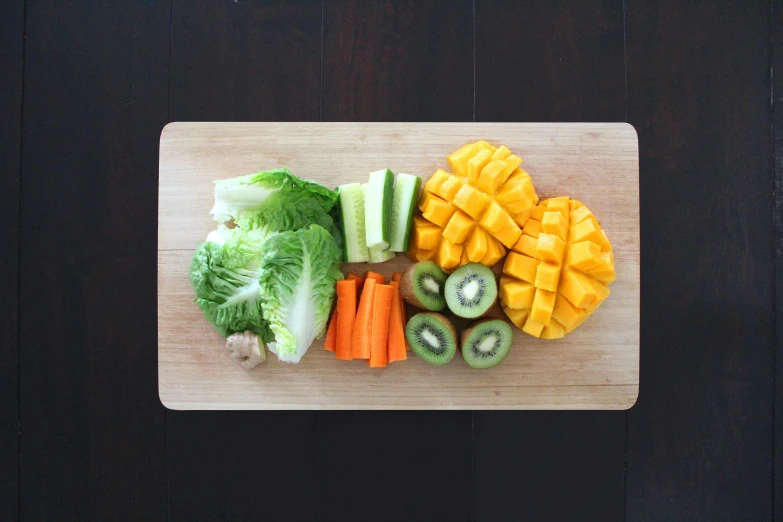 a cutting board with fruits and vegetables on it, pexels, mango, lettuce, 🦩🪐🐞👩🏻🦳, cinematic very crisp