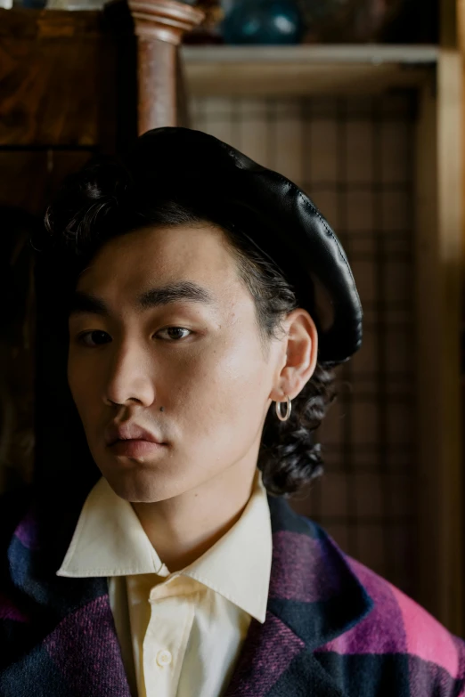 a close up of a person wearing a hat, an album cover, inspired by Yukihiko Yasuda, portrait of young man, utagawa kunisada & salvador dali, nonbinary model, berets