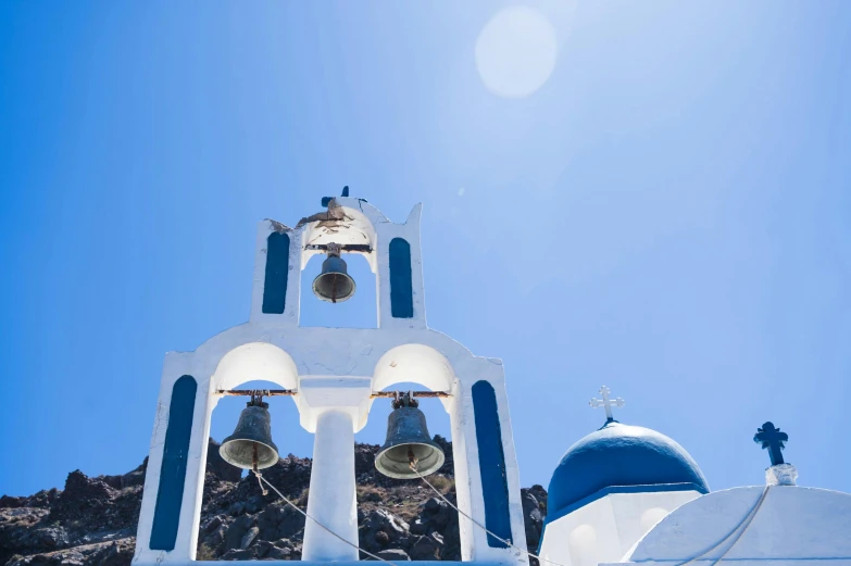 a blue and white church with a bell tower, a photo, pexels contest winner, square, neon greek, white + blue + gold + black, sirens