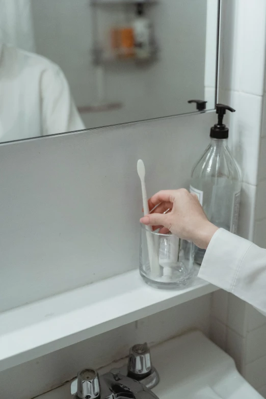 a woman brushing her teeth in front of a mirror, unsplash, plasticien, hyperdetailed scp artifact jar, low quality photo, realistic », sustainable materials