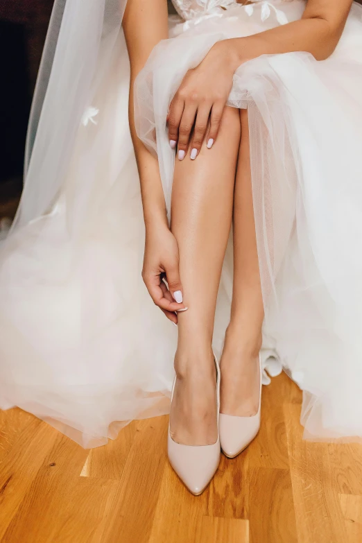 a woman in a wedding dress sitting on a wooden floor, shutterstock, renaissance, stilettos, light tan, pastel', multiple stories