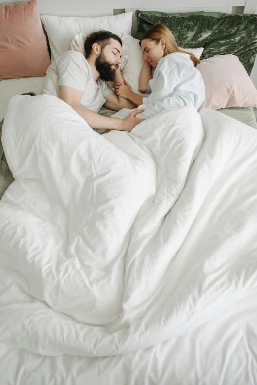 a couple of people laying in bed next to each other, soft shapes, cozy bed, white, large tall