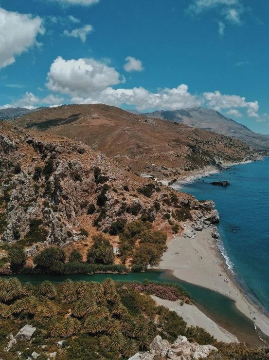 a large body of water next to a sandy beach, by Alexis Grimou, pexels contest winner, hurufiyya, beach is between the two valleys, 2 5 6 x 2 5 6 pixels, drone view, greek setting