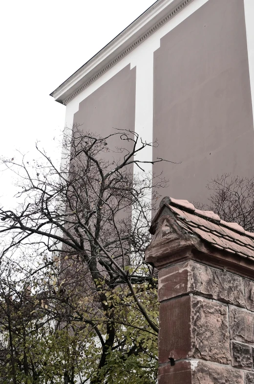 a clock that is on the side of a building, inspired by Mihály Munkácsy, with a few scars on the tree, chimneys, low quality photo, shaved temple