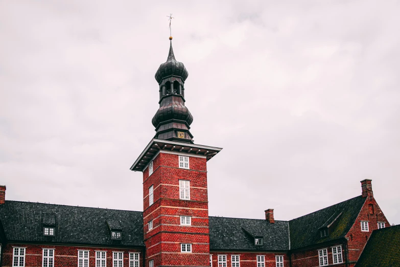 a red brick building with a clock tower, by Christen Dalsgaard, unsplash, lead - covered spire, hospital, low quality photo, hammershøi