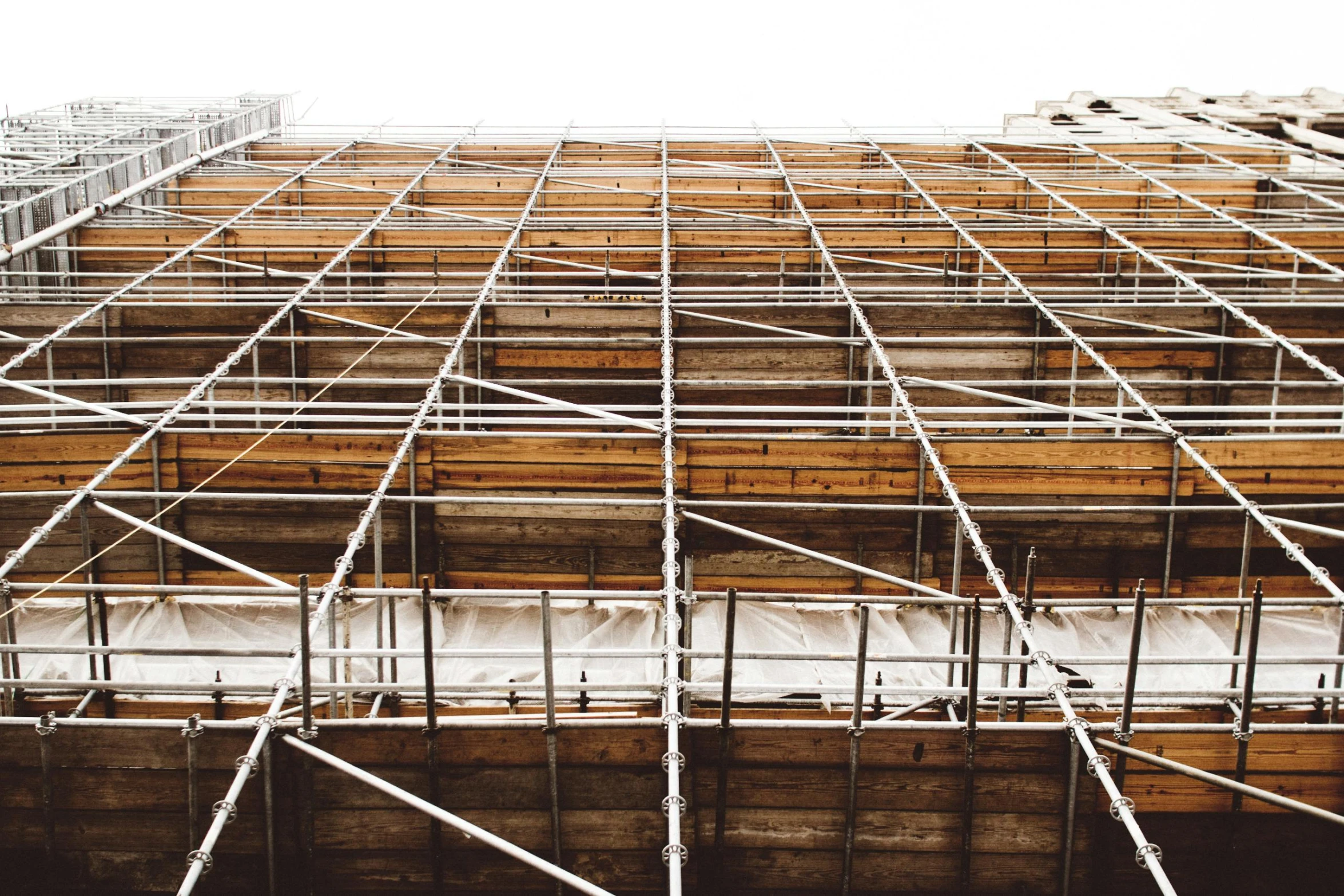 a group of scaffolding on the side of a building, a portrait, unsplash, renaissance, square lines, a wooden, covered in, the best