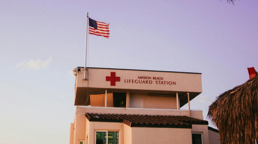 a lifeguard station with an american flag on top, unsplash, renaissance, medical complex, instagram post, 🚿🗝📝