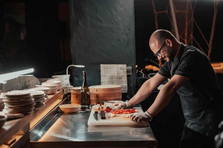 a man cutting a pizza on a cutting board, a portrait, by Julia Pishtar, pexels contest winner, tokyo izakaya scene, profile image, thumbnail, view from the side