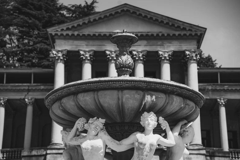 a black and white photo of three statues in front of a fountain, by Emma Andijewska, pexels contest winner, neoclassicism, mansion, 1940s photo, rotunda, summertime