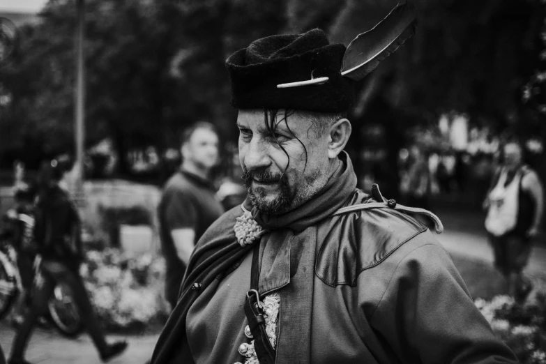 a black and white photo of a man in costume, a black and white photo, by Adam Marczyński, renaissance, 8k 50mm iso 10, 15081959 21121991 01012000 4k, candid portrait photo, colour corrected