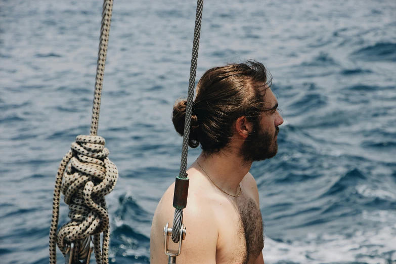 a man standing on top of a boat next to the ocean, pexels contest winner, renaissance, braided beard redhead dreadlocks, 26 year old man on a sailboat, profile image, barrel chested