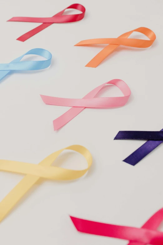 a white table topped with lots of different colored ribbons, by Nina Hamnett, trending on pexels, medical labels, close up front view, multiple stories, tonal colors