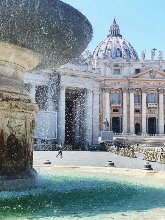 a fountain in front of a building with a dome in the background, by Cagnaccio di San Pietro, pexels contest winner, neoclassicism, slide show, kneeling before the pope, panoramic shot, snapchat photo