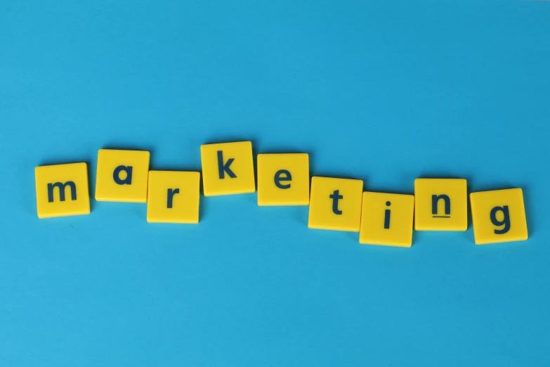 the word marketing spelled in scrabbles on a blue background, a picture, trending on pixabay, on a yellow canva, square, arial shot, taken from the high street