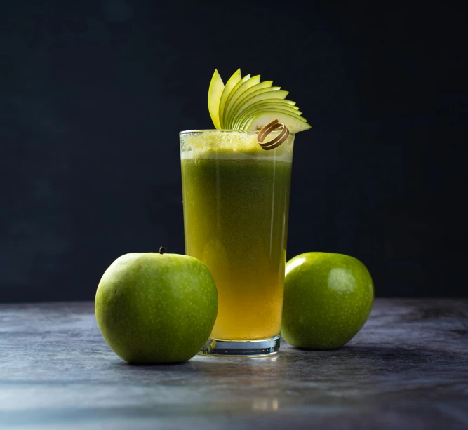 a drink sitting on top of a table next to green apples, profile pic, dramatic product shot, thumbnail, half length shot